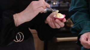 putting the filling inside the eggs