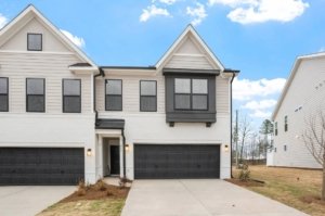 Grey and black exterior of an end unit townhome