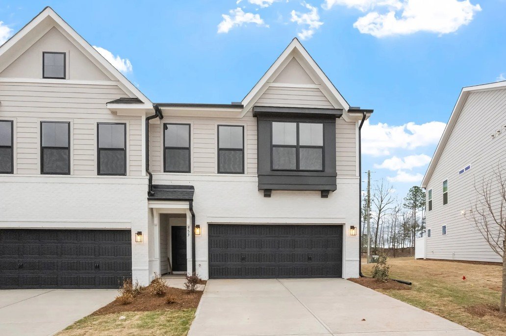 Grey and black exterior of an end unit townhome